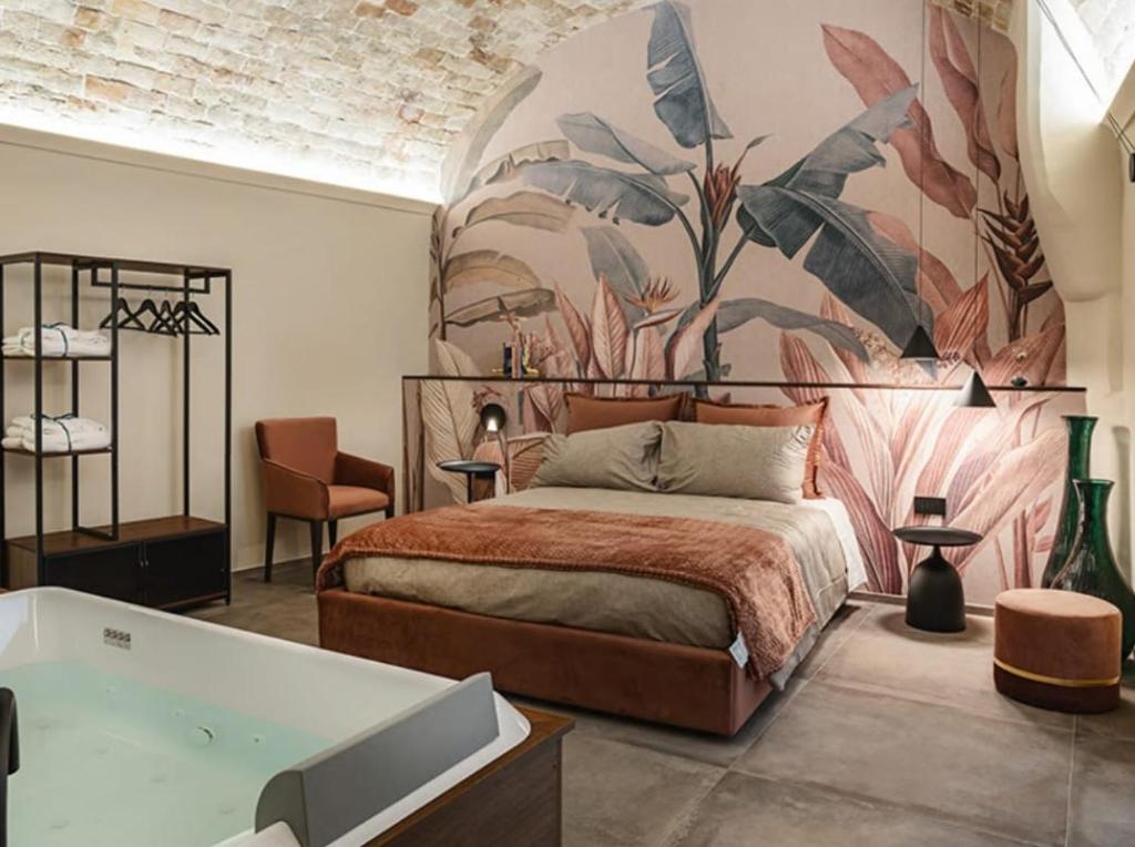 a bedroom with a bed and a bath tub at MATTEI LUXURY B&B in Altamura