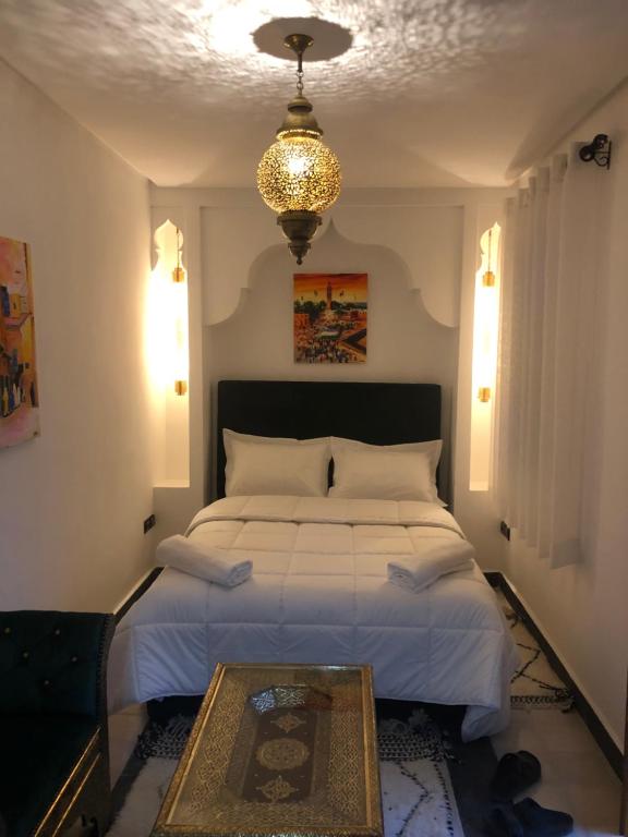 Postel nebo postele na pokoji v ubytování Riad Orient Palace