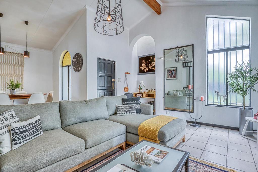 a living room with a couch and a table at The Spanish House in Centurion