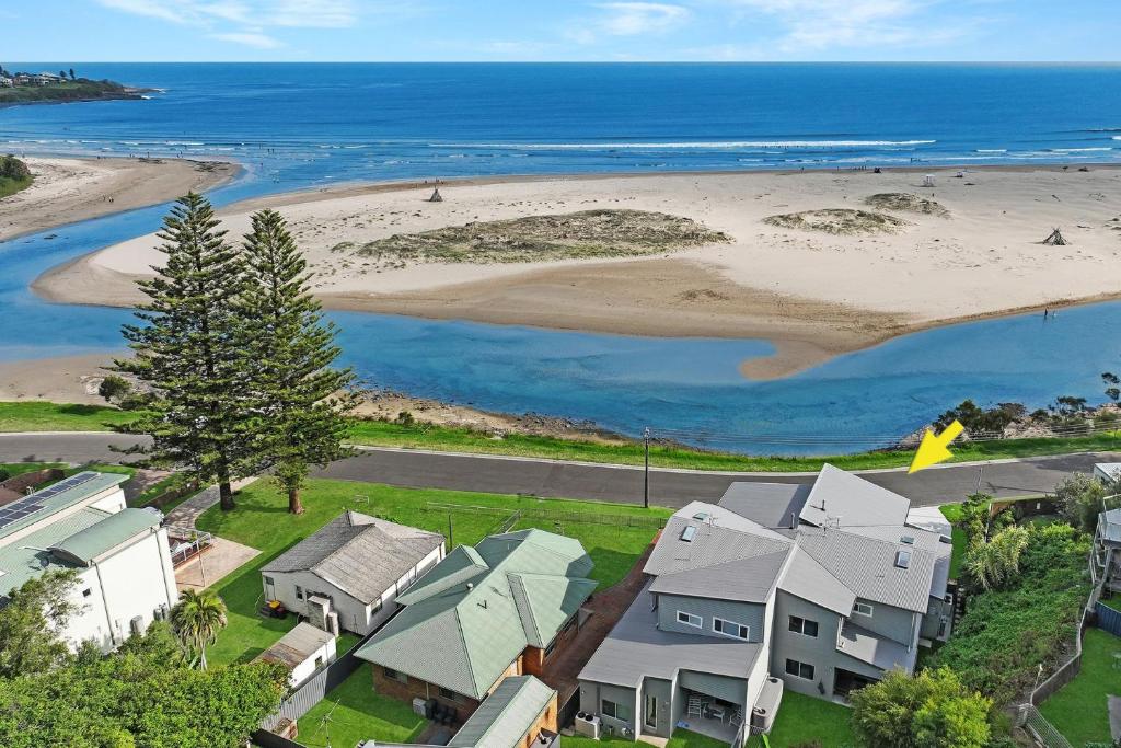 an aerial view of a beach with houses at Southcape, Gerroa in Gerroa
