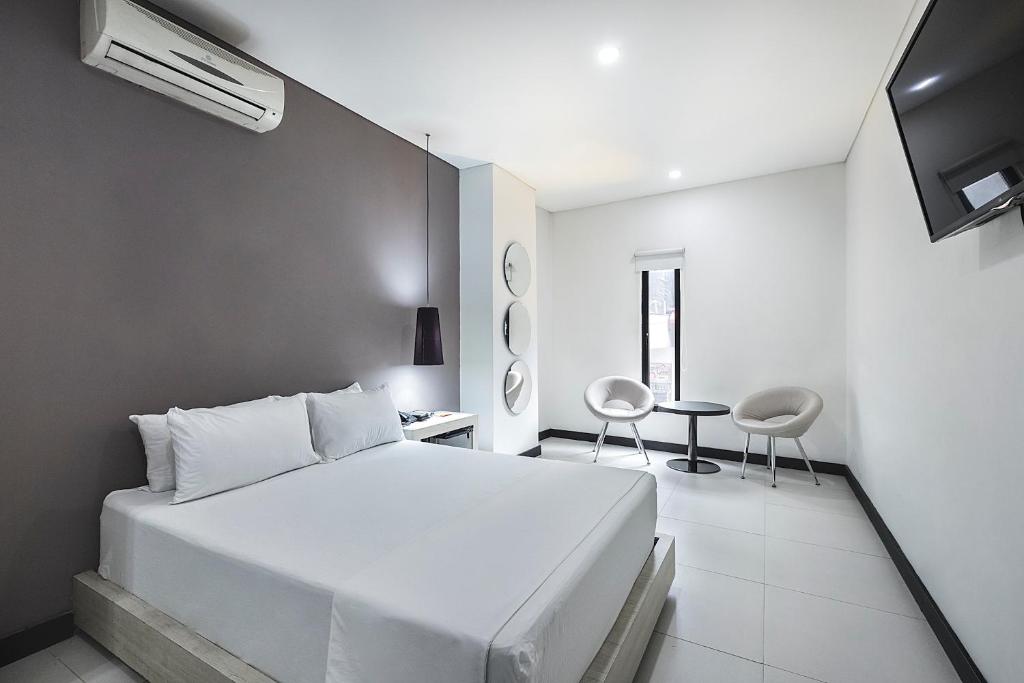 Postel nebo postele na pokoji v ubytování Hotel 47 Medellin Center