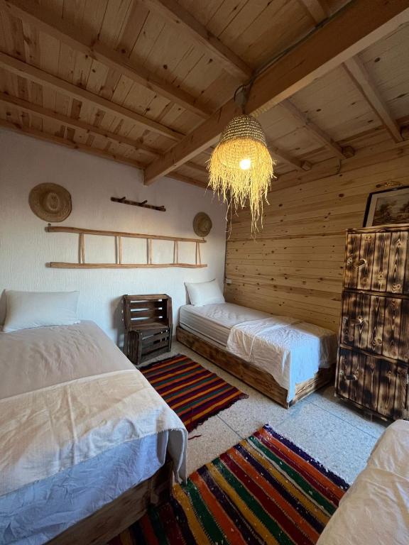Postel nebo postele na pokoji v ubytování Heaven Surf Camp