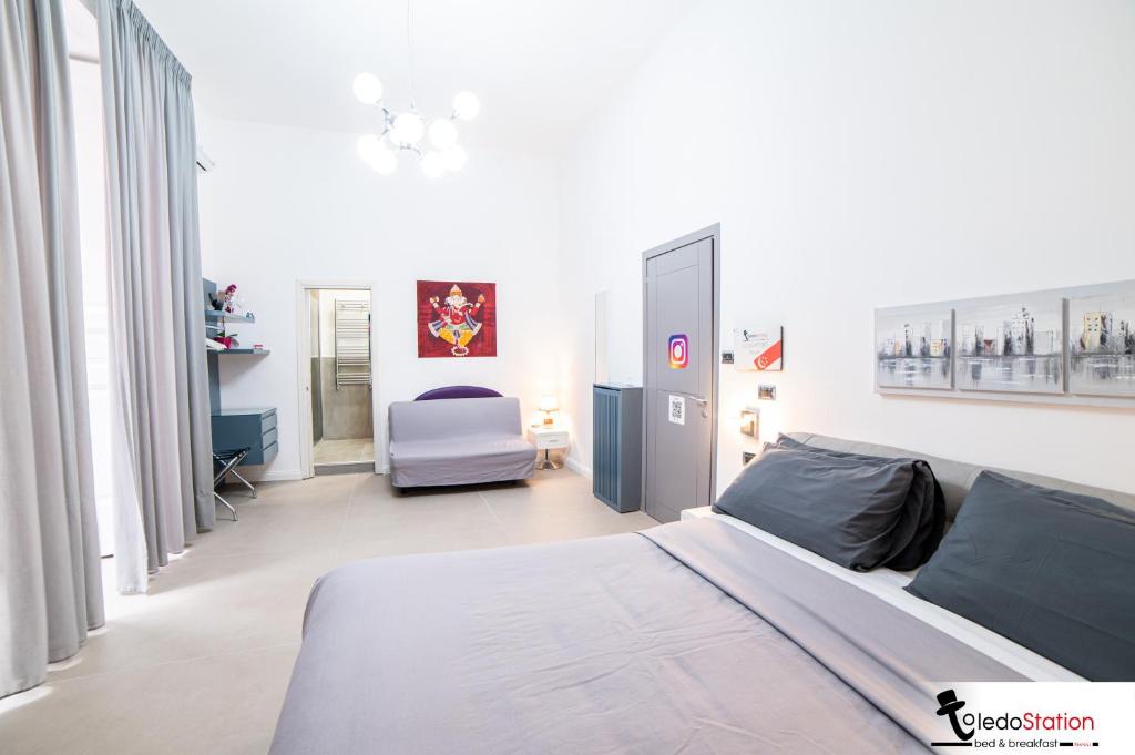 Postel nebo postele na pokoji v ubytování ToledoStation B&B