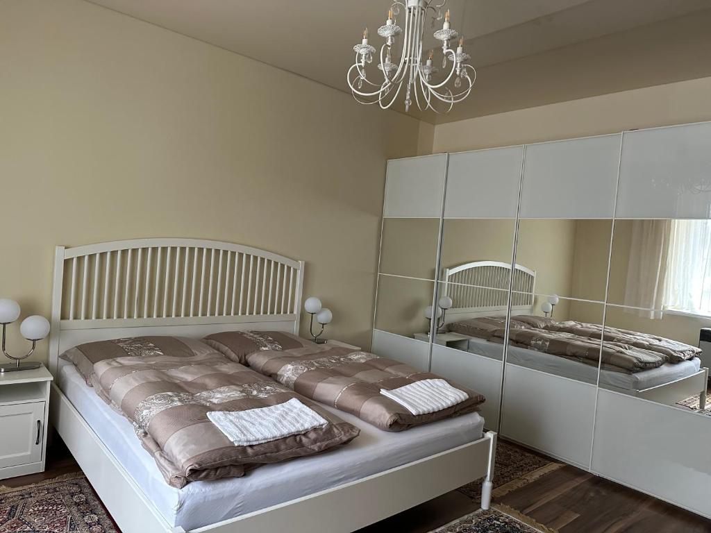 Posteľ alebo postele v izbe v ubytovaní APARTMEN PRAHA