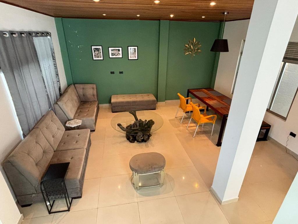 a living room with a couch and a table at Moderna casa en el corazon de Leticia in Leticia