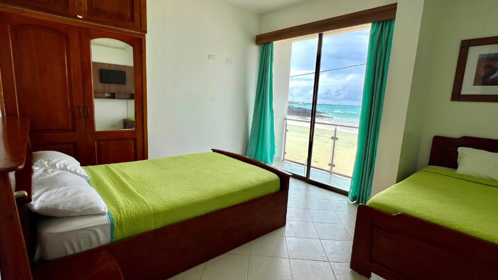 Postel nebo postele na pokoji v ubytování Hotel Sierra Negra