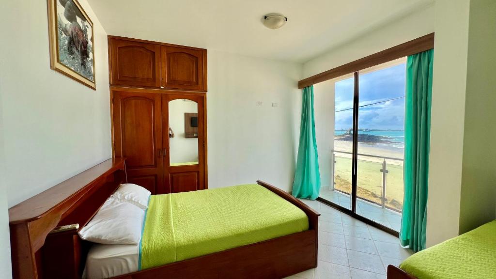 Postel nebo postele na pokoji v ubytování Hotel Sierra Negra