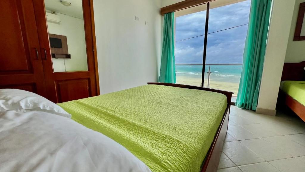 Postel nebo postele na pokoji v ubytování Hotel Sierra Negra