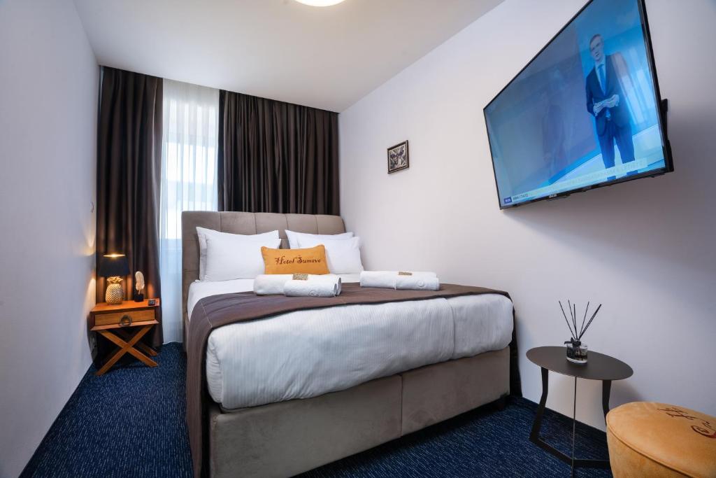 Postel nebo postele na pokoji v ubytování Hotel Šumava