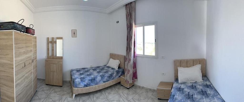 Postel nebo postele na pokoji v ubytování Dyar Amina