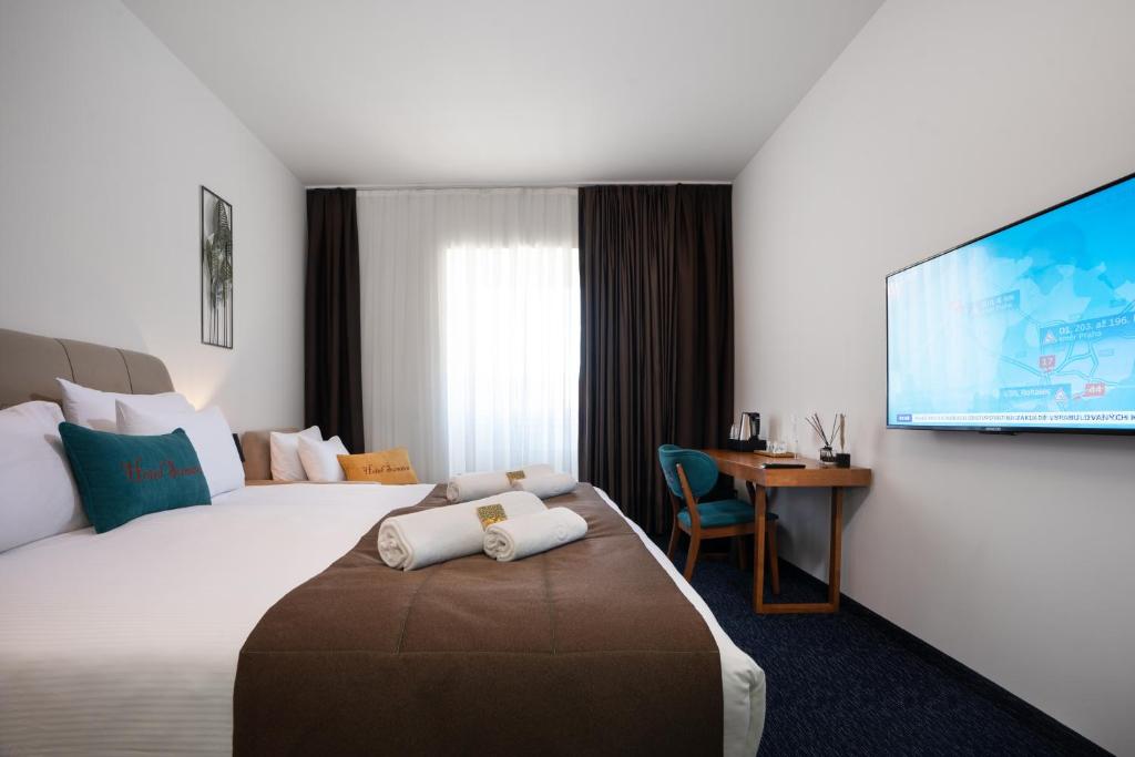 Postel nebo postele na pokoji v ubytování Hotel Šumava