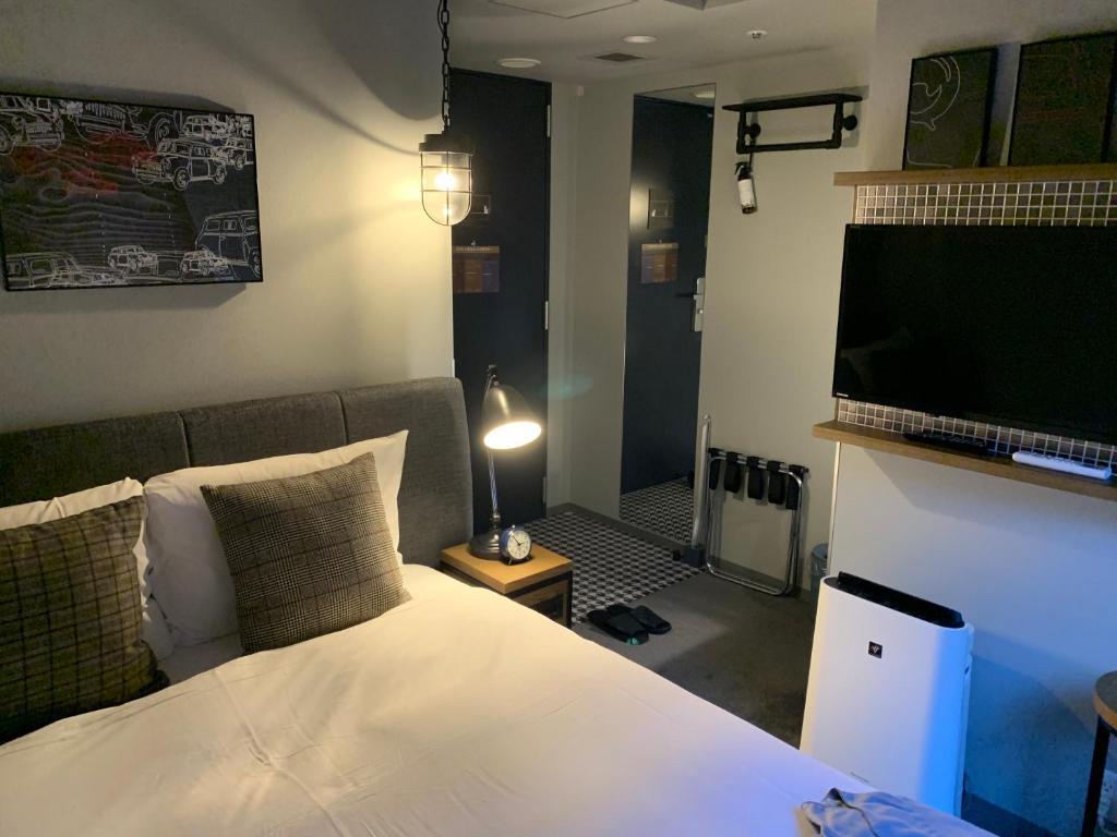 Postel nebo postele na pokoji v ubytování Hotel Resol Akihabara