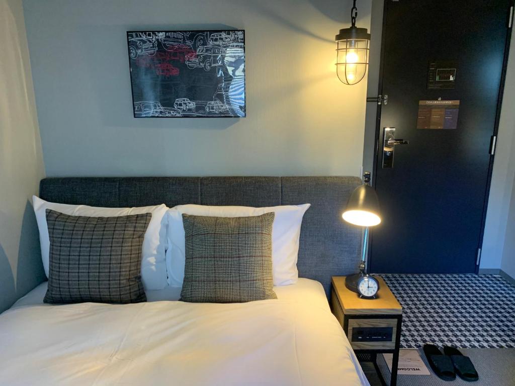 Postel nebo postele na pokoji v ubytování Hotel Resol Akihabara
