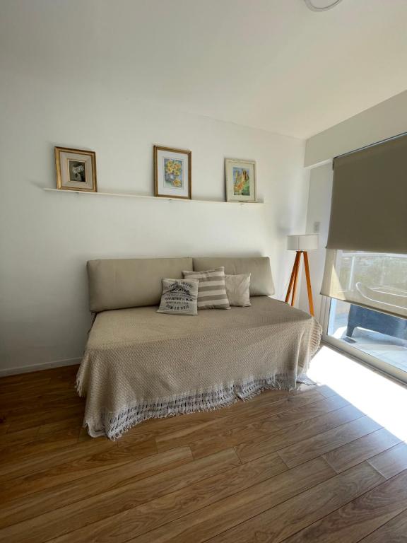a bedroom with a bed with two pillows on it at Departamento en Santa Fe, Capital. Con cochera y pileta in Santa Fe