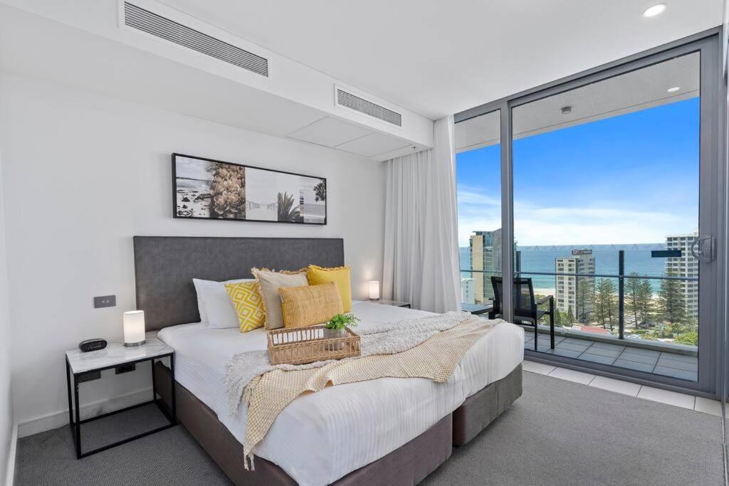 a bedroom with a large bed and a large window at Spectacular Views from Wyndham Apartment in Gold Coast