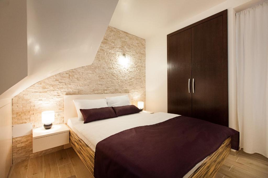 Postel nebo postele na pokoji v ubytování Apartments Villa Bianca