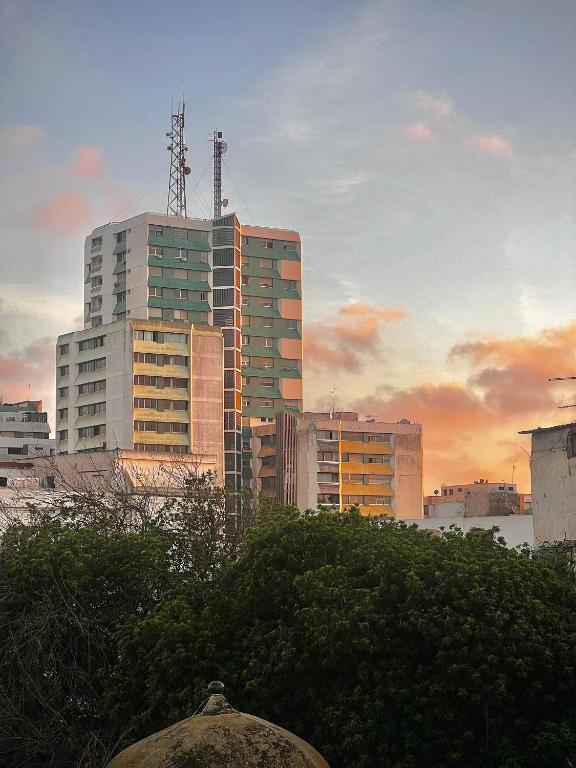 a group of tall buildings in a city at Dar al waha medina in Rabat