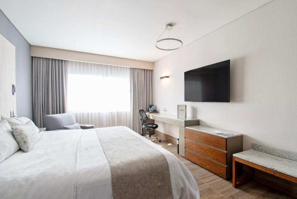 TV a/nebo společenská místnost v ubytování Hotel Plaza Diana
