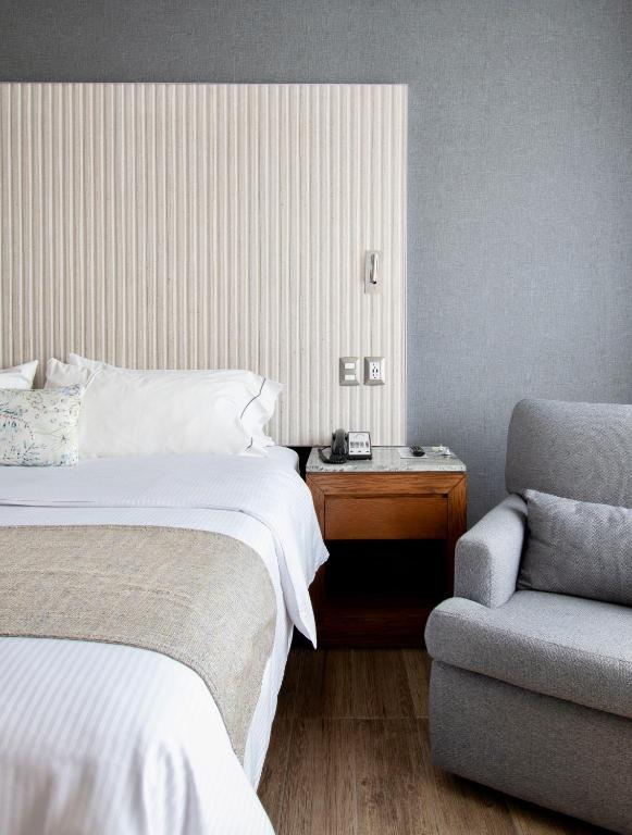 Postel nebo postele na pokoji v ubytování Hotel Plaza Diana