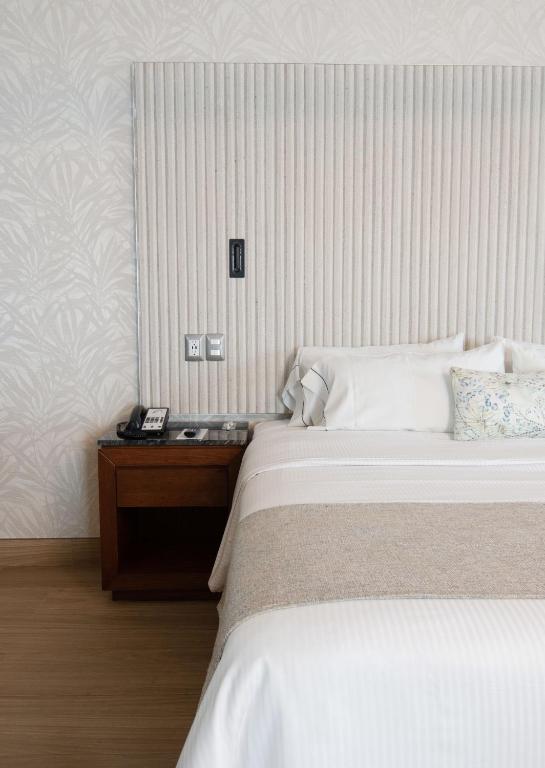 Postel nebo postele na pokoji v ubytování Hotel Plaza Diana