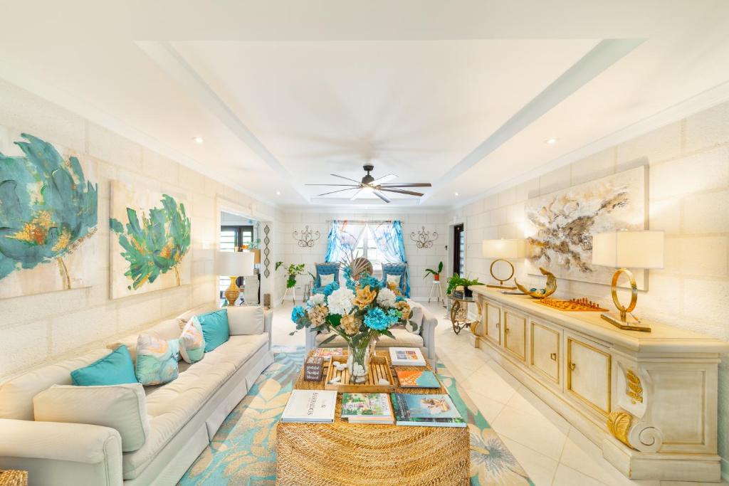 a living room with a couch and a table at Hidden Gem Barbados in Christ Church