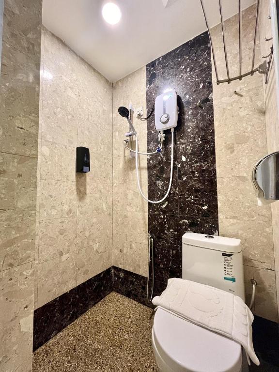 Koupelna v ubytování Asimmy Hotel
