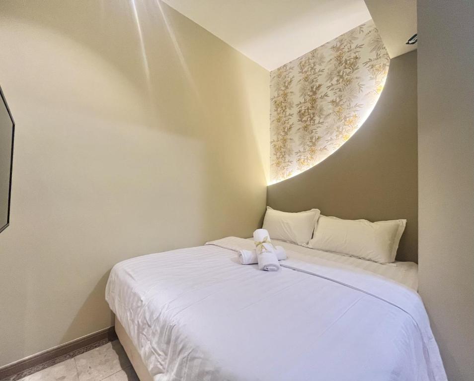 Postel nebo postele na pokoji v ubytování Asimmy Hotel