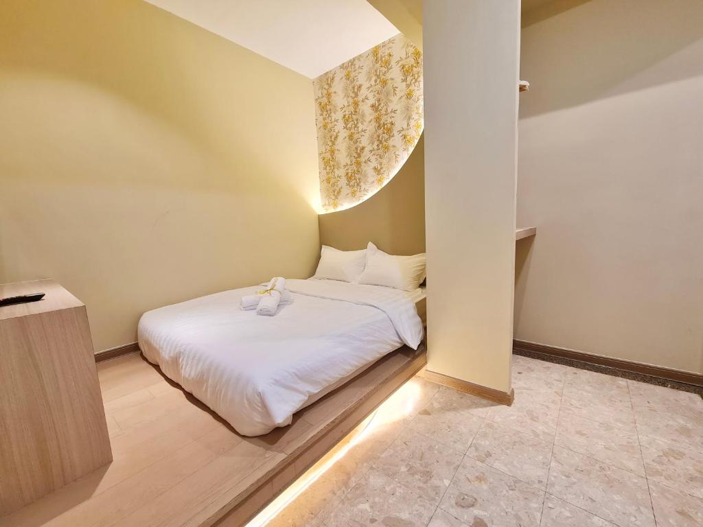 Postel nebo postele na pokoji v ubytování Asimmy Hotel