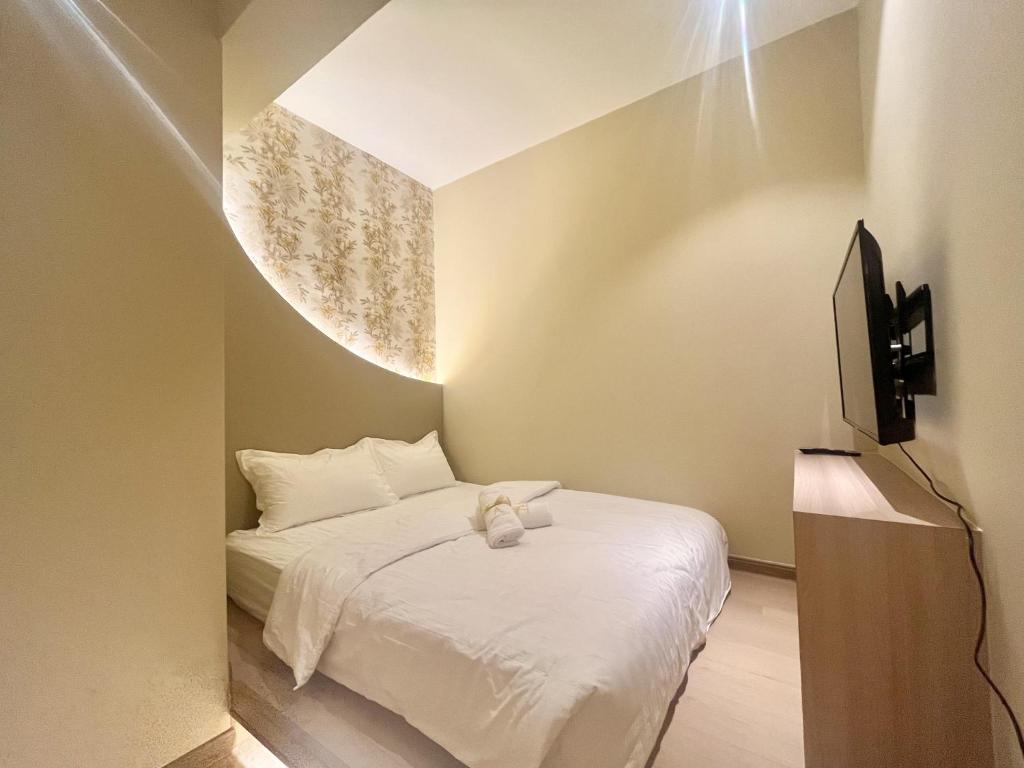 TV a/nebo společenská místnost v ubytování Asimmy Hotel