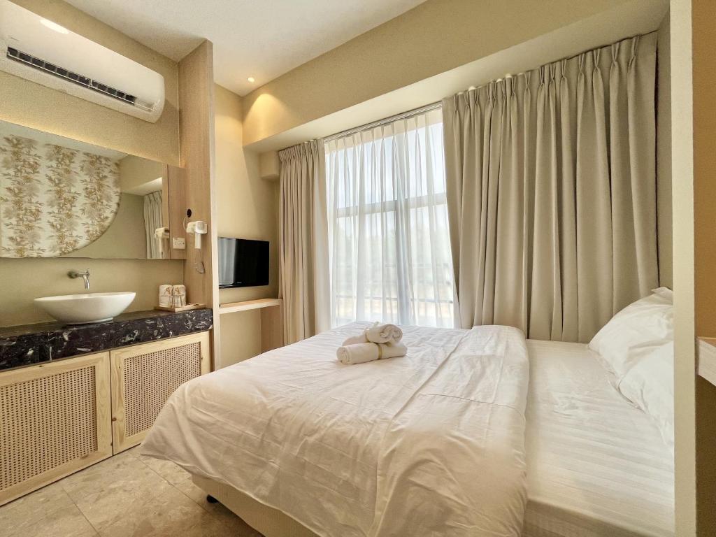 Postel nebo postele na pokoji v ubytování Asimmy Hotel