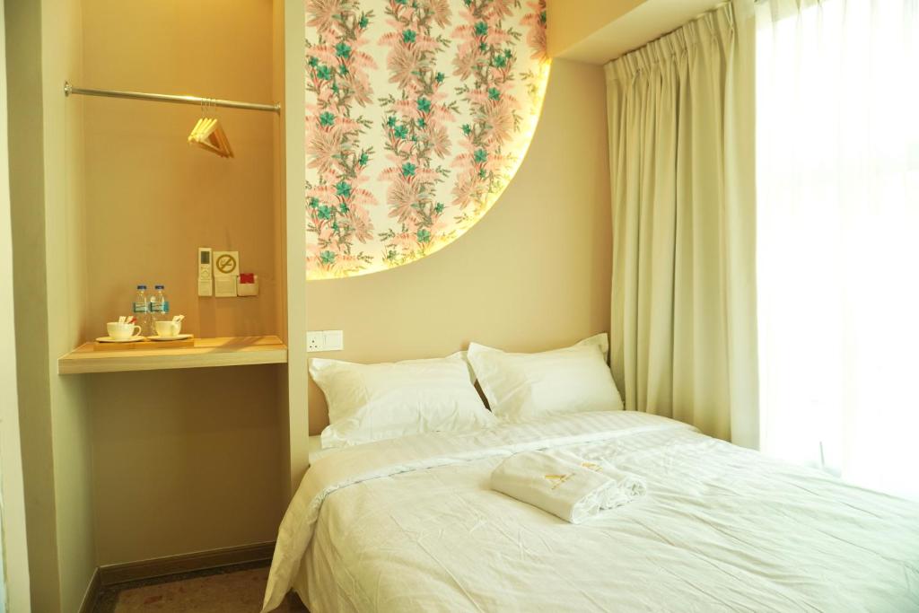 Postel nebo postele na pokoji v ubytování Asimmy Hotel