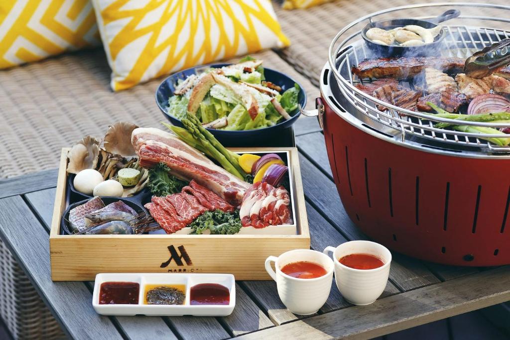 a table with a tray of food and two bowls of food at Tokyo Marriott Hotel in Tokyo