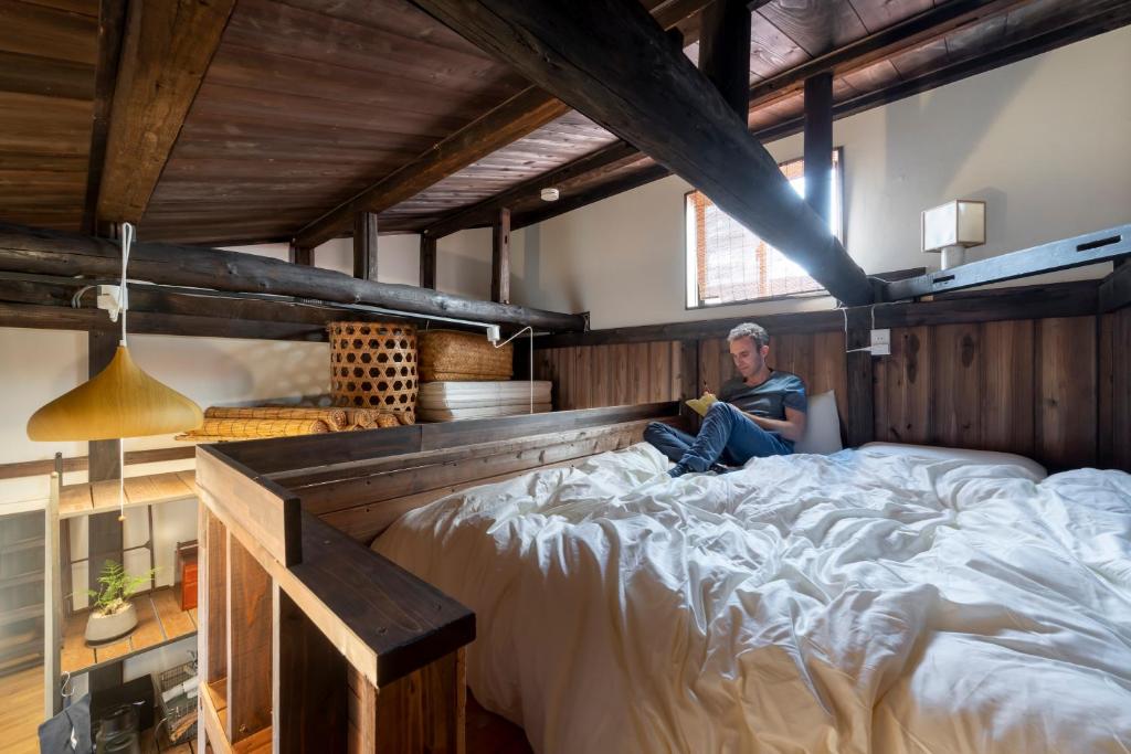Postel nebo postele na pokoji v ubytování Hotel Suzumeya Tsukiji ホテルすずめや築地