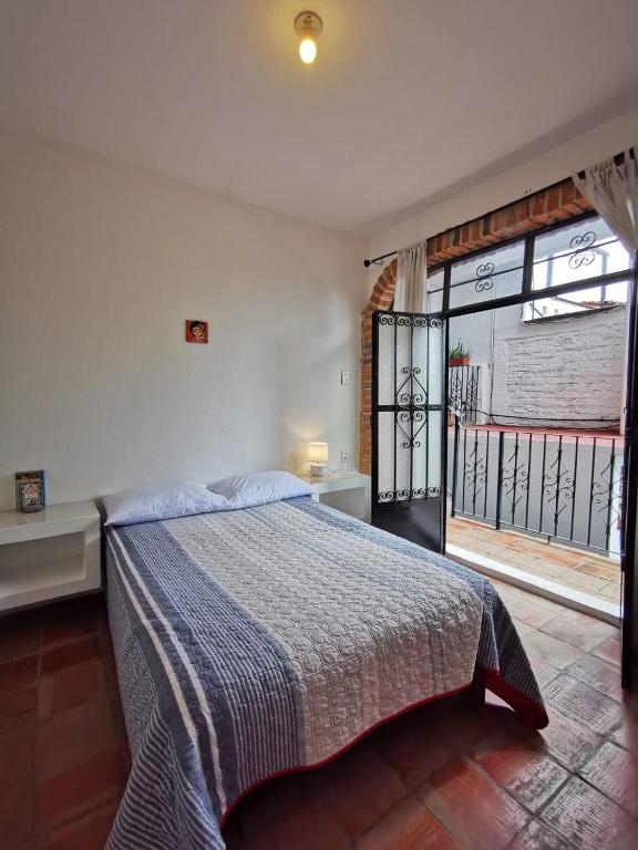 Postel nebo postele na pokoji v ubytování Casa Rey Sol Vallarta