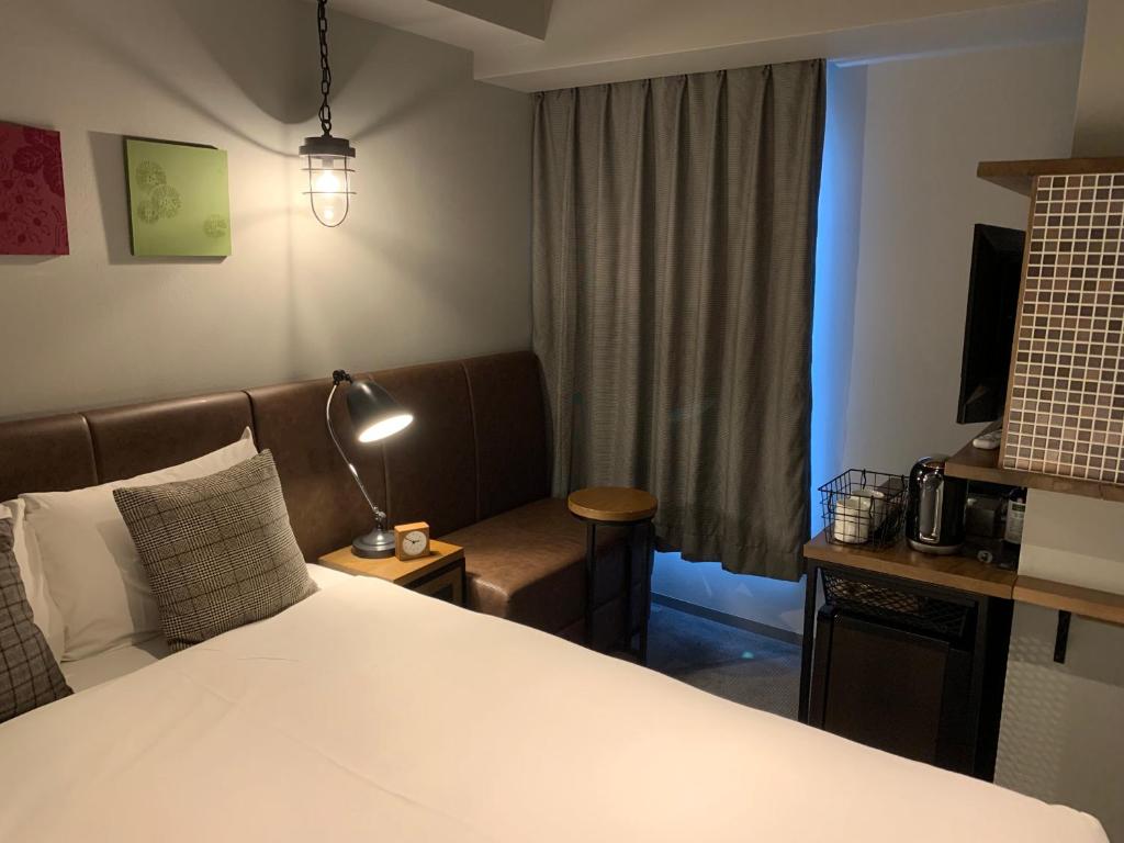 Postel nebo postele na pokoji v ubytování Hotel Resol Akihabara