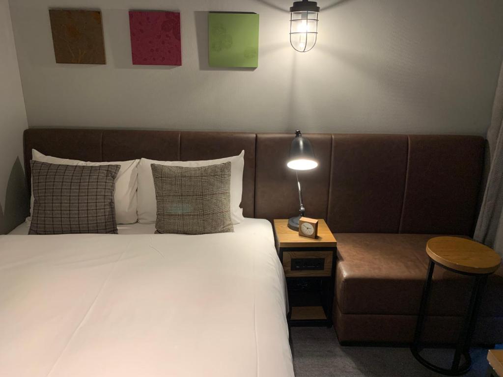 Postel nebo postele na pokoji v ubytování Hotel Resol Akihabara