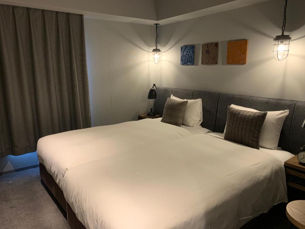 Postel nebo postele na pokoji v ubytování Hotel Resol Akihabara