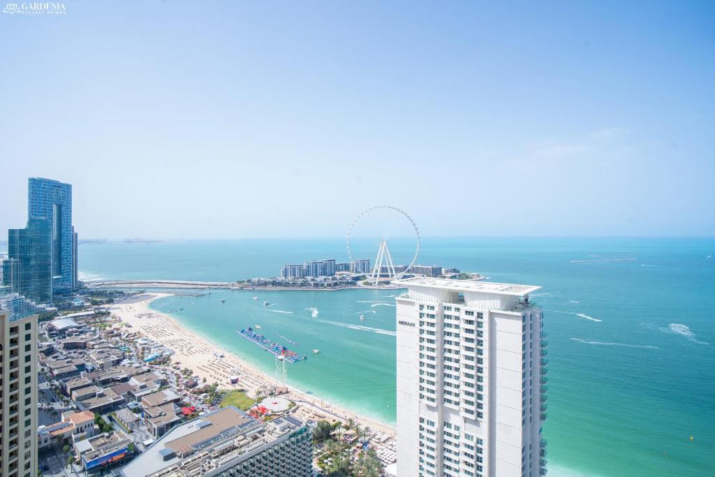an aerial view of a beach and the ocean at Gardenia Al Fattan Marine Suites - Luxury Apartments in JBR with Full Sea View and only 2m walk to Beach in Dubai