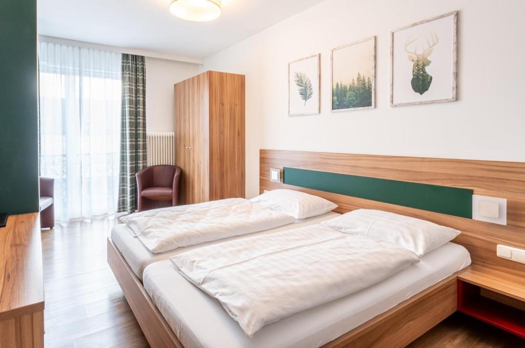 Postel nebo postele na pokoji v ubytování Leonfeldner-Hof