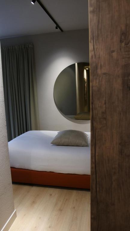 Postel nebo postele na pokoji v ubytování Hotel Battisti 31