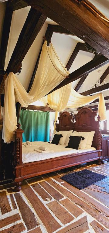 a bedroom with a canopy bed in a room at Rustic Charm a Unique and Antique Apartment in Zagreb