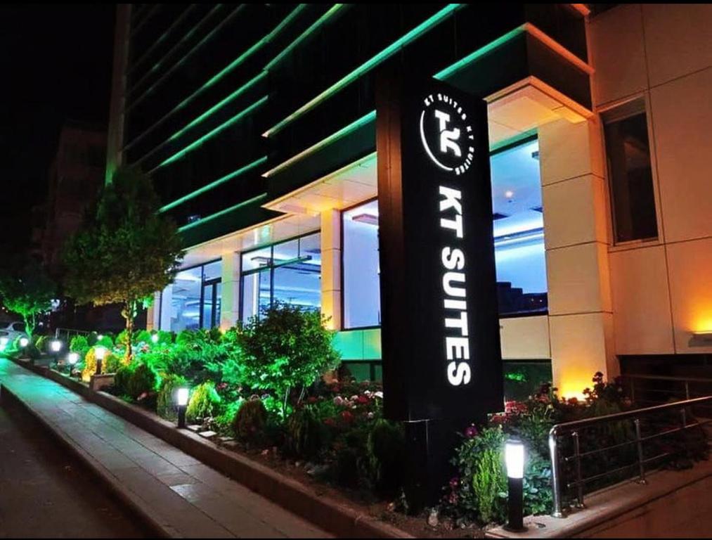 a hotel sign in front of a building at night at KT SUİTE in Ankara
