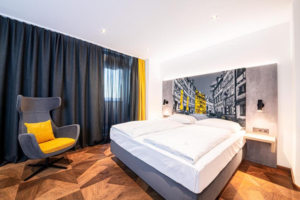 Postel nebo postele na pokoji v ubytování Arotel Best living Nürnberg
