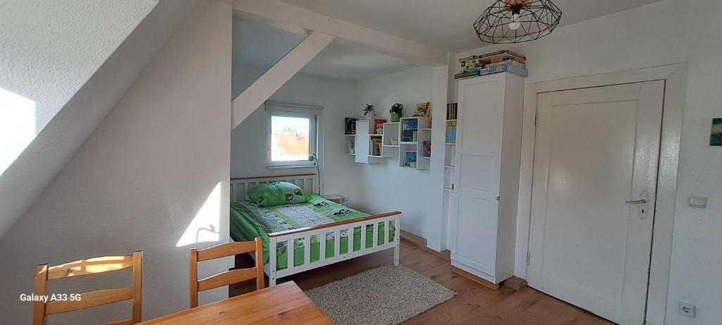 a childs room with a crib and a window at Judits Apartments in Berlin