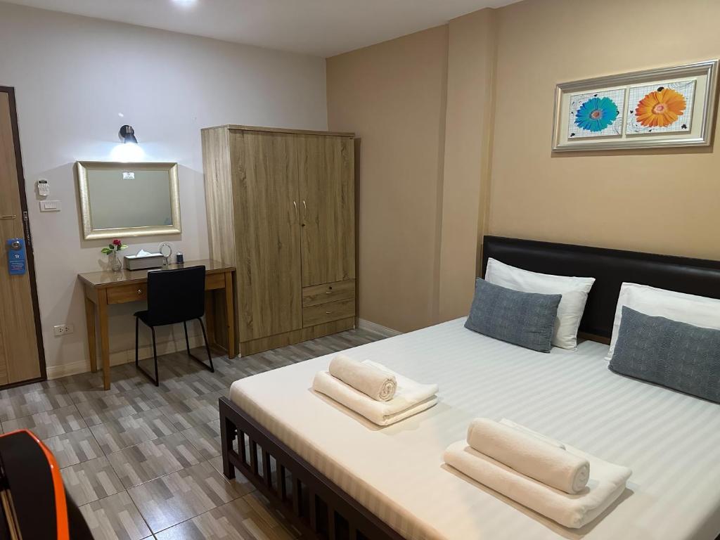En eller flere senge i et værelse på Baanfahsai