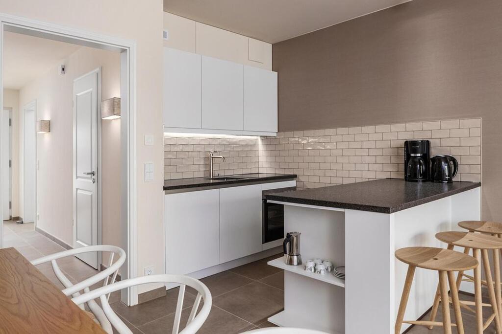 Kuchyň nebo kuchyňský kout v ubytování Aalernhüs hotel & spa