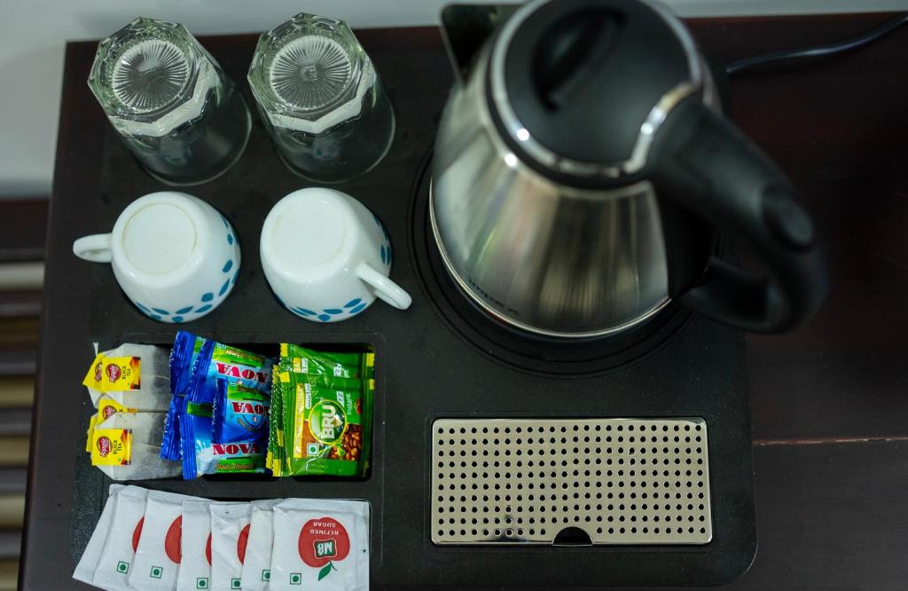Příslušenství pro přípravu čaje a kávy v ubytování The Cascade Munnar