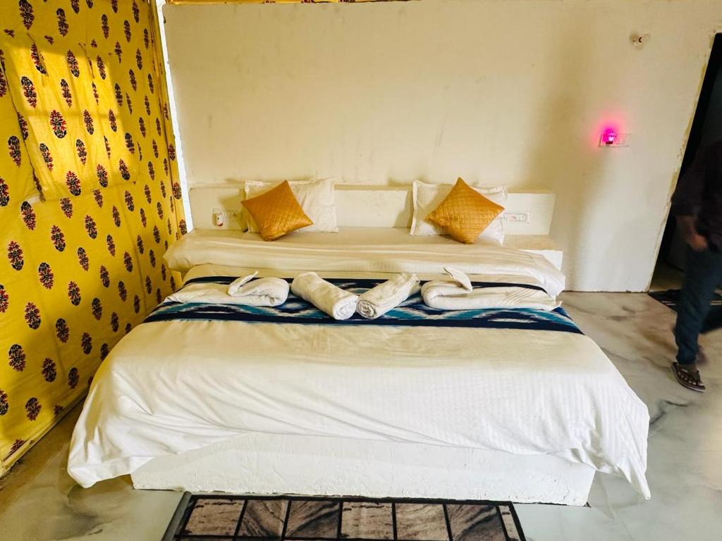 Voodi või voodid majutusasutuse Raghav Resort toas