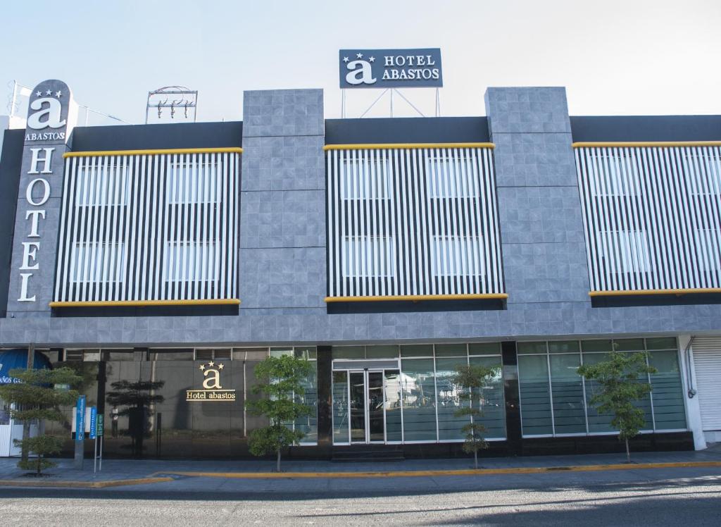 a building with a sign that reads hotel australias at Hotel Expo Abastos in Guadalajara