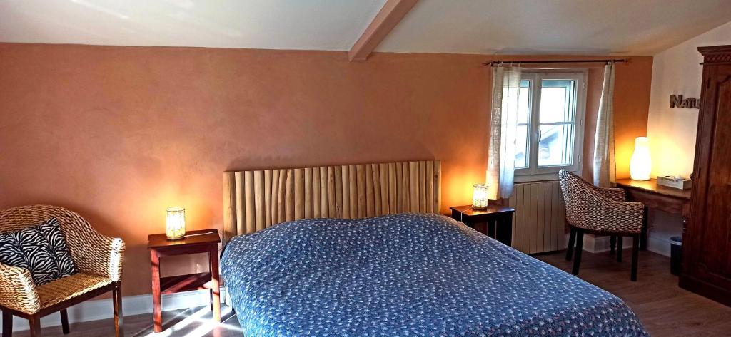 Ένα ή περισσότερα κρεβάτια σε δωμάτιο στο Chambre d'hôtes Park des Collines - Gîte
